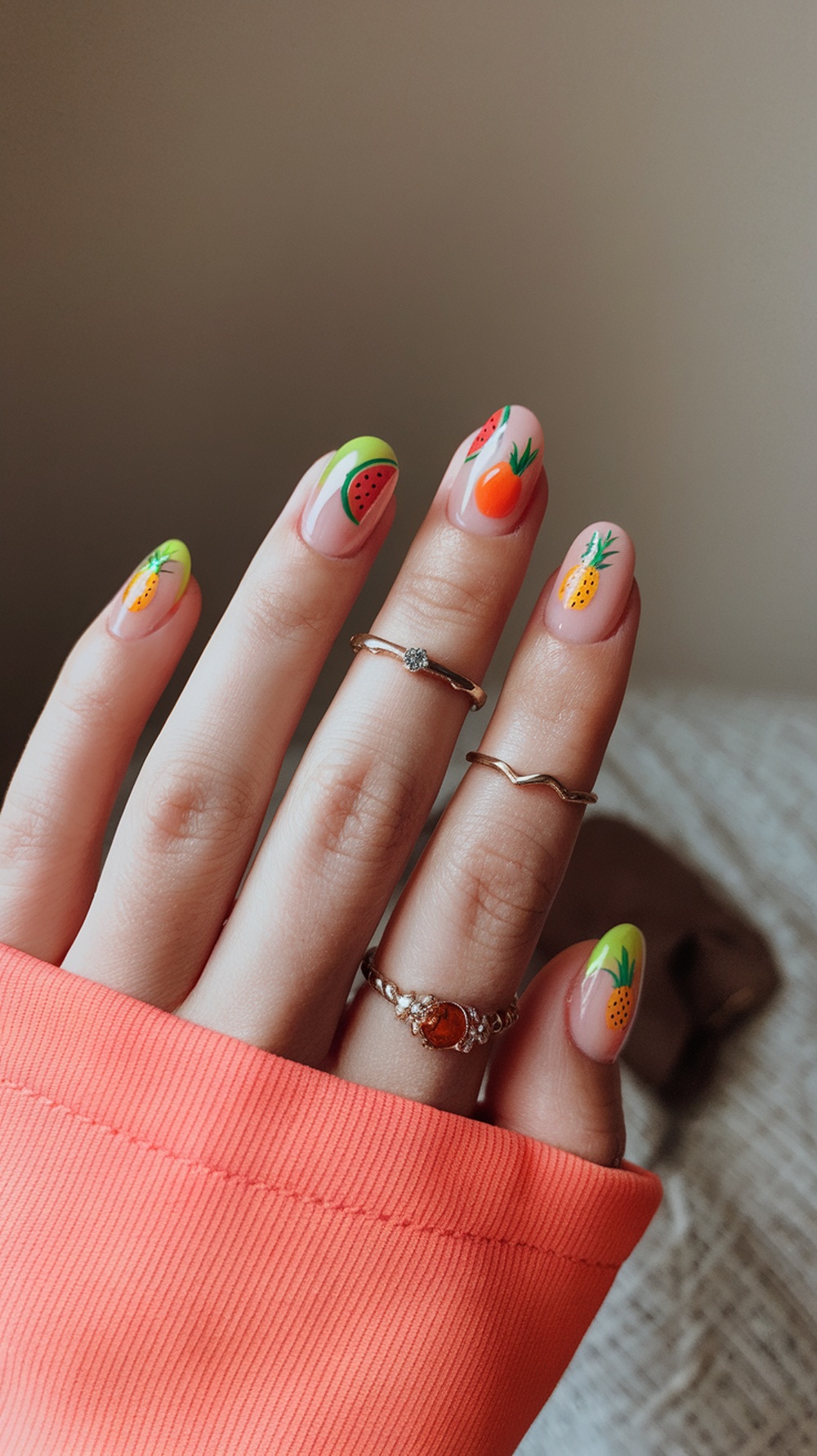 20 Stunning July Nail Designs | Must Try This Summer 10 Nails featuring fruit designs like watermelon, pineapple, and orange on a light background.