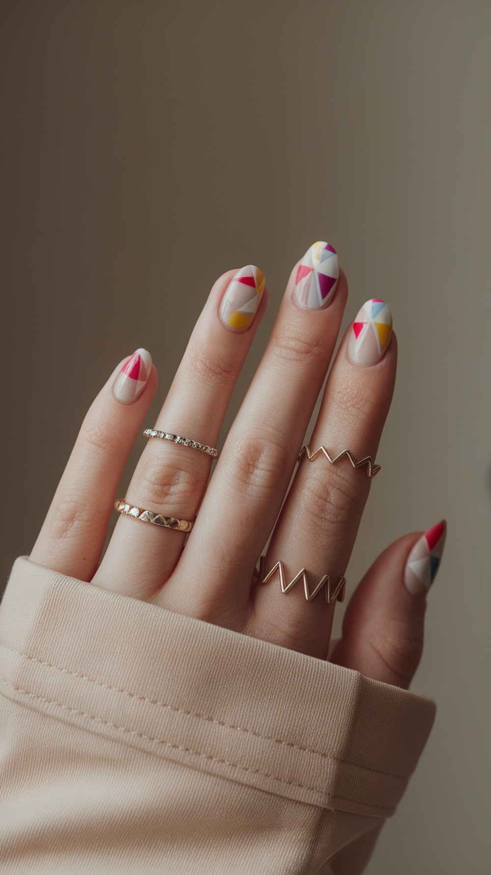 20 Stunning July Nail Designs | Must Try This Summer 21 Close-up of hands with geometric summer nail designs in bright colors